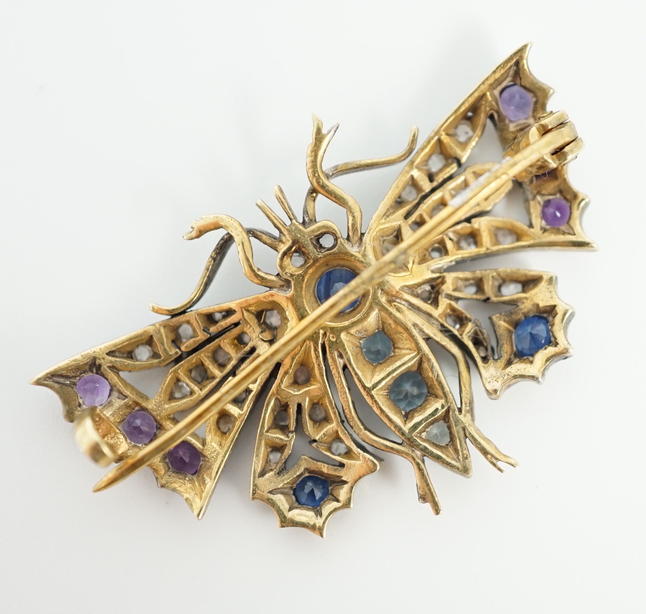 A Victorian gold and silver, diamond, amethyst, sapphire and aquamarine? set butterfly brooch